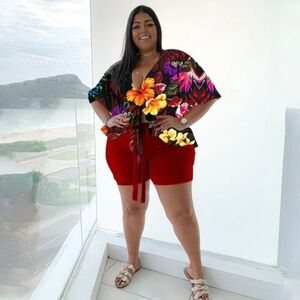 Colorful Floral Top with Red Shorts